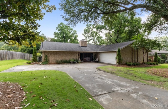 ranch-style house with a front lawn and a garage