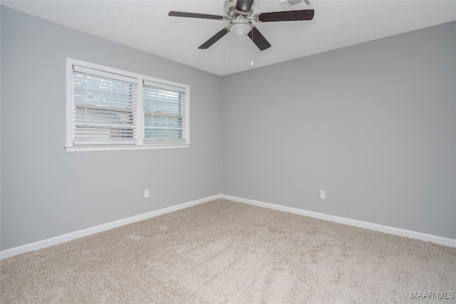 unfurnished room with carpet floors and ceiling fan