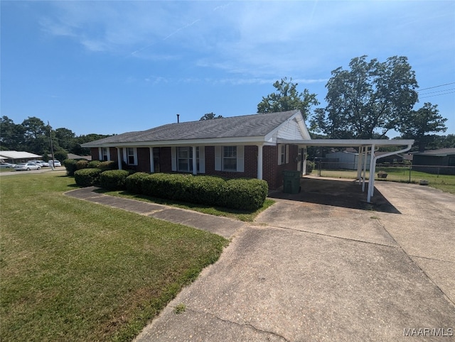 view of front facade featuring a front yard and a carport