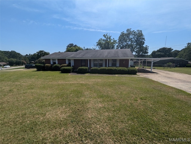 view of front of house with a front yard and a carport