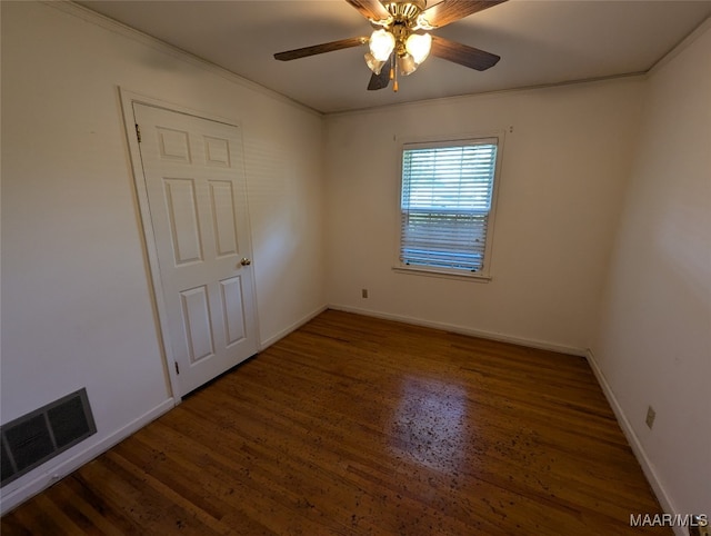 unfurnished room featuring ceiling fan and dark wood-type flooring