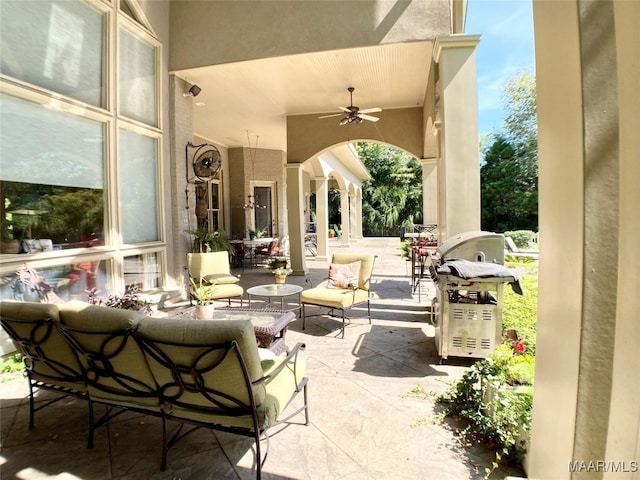 view of patio / terrace with ceiling fan and an outdoor hangout area