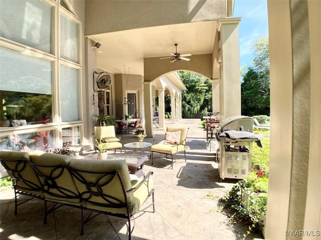 view of patio / terrace with area for grilling and a ceiling fan