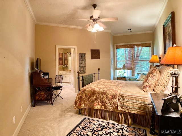 carpeted bedroom with ceiling fan, ensuite bath, and ornamental molding