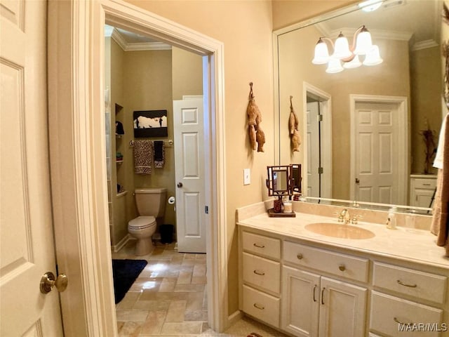 bathroom with stone finish floor, a chandelier, ornamental molding, toilet, and vanity