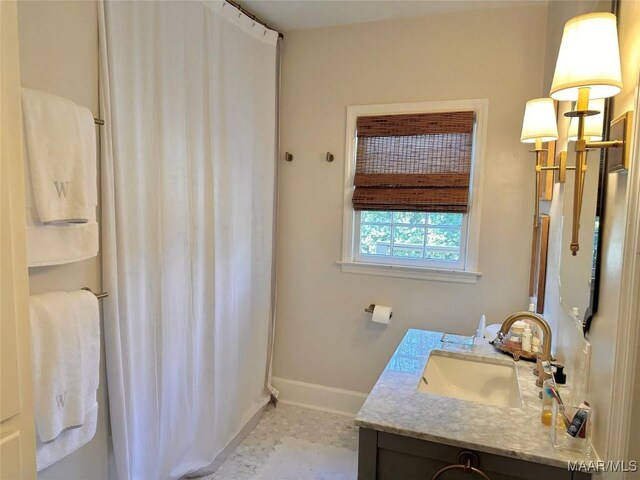 bathroom with tile patterned floors and vanity