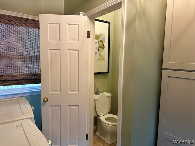 bathroom with tile patterned flooring and toilet