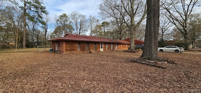 view of side of property featuring central AC