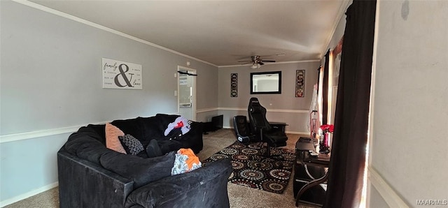 living room featuring ceiling fan, ornamental molding, and carpet floors