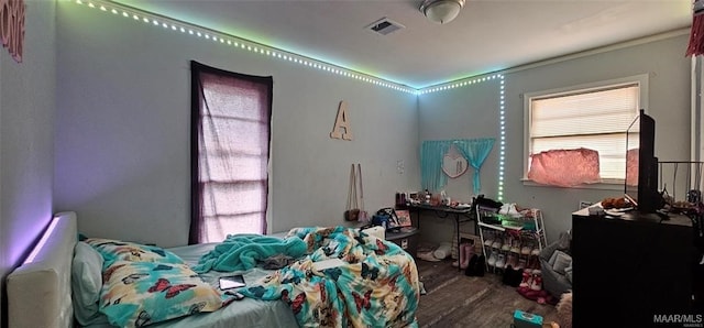 bedroom with wood-type flooring