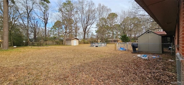 view of yard featuring a storage unit