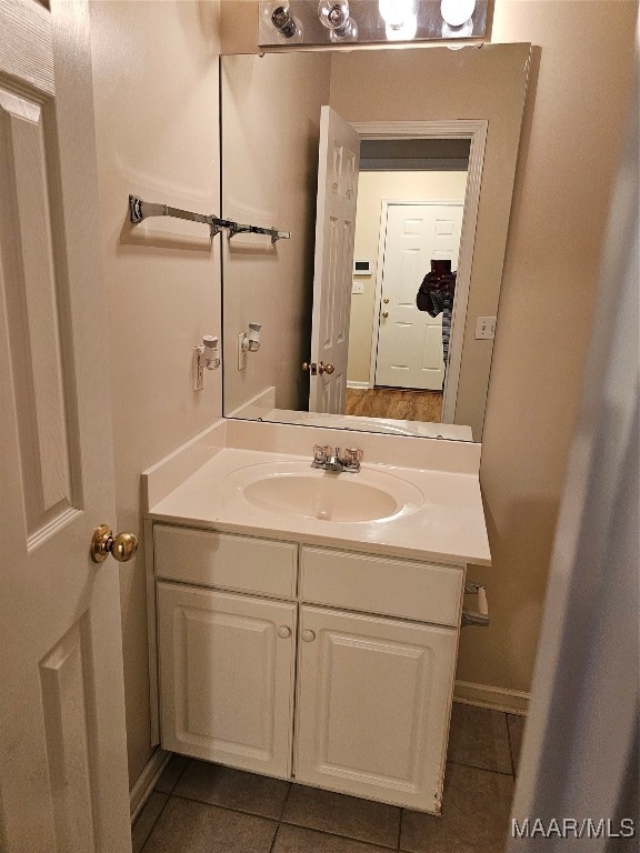 bathroom with tile patterned floors and vanity