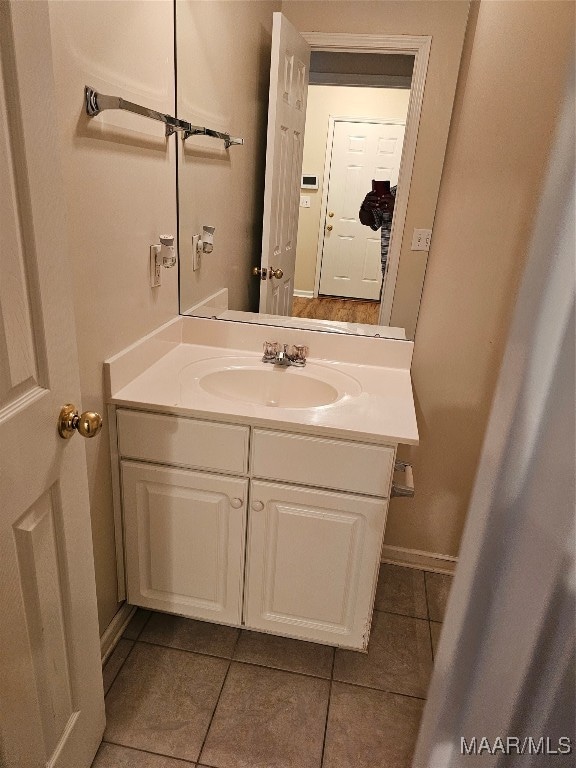 bathroom with vanity and tile patterned flooring