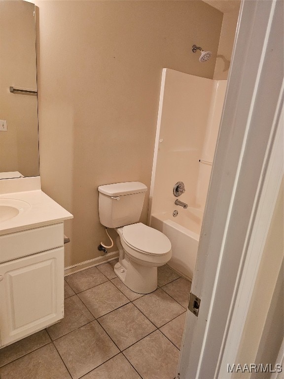 full bathroom featuring tile patterned floors, vanity, toilet, and shower / washtub combination