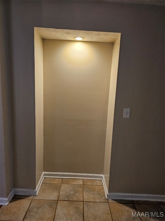 interior details featuring tile patterned floors