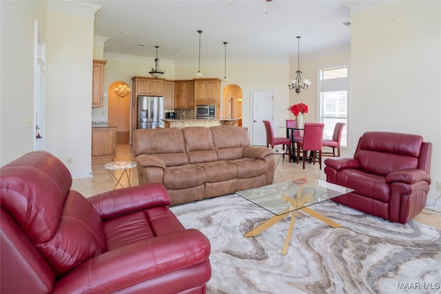 living room featuring ornamental molding, light tile patterned floors, and a chandelier