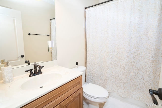 bathroom with toilet and vanity