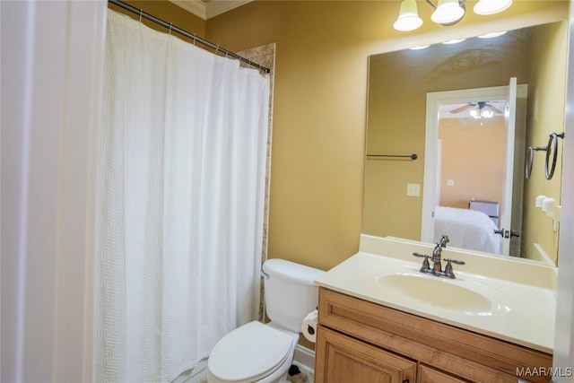 bathroom featuring ceiling fan, vanity, and toilet