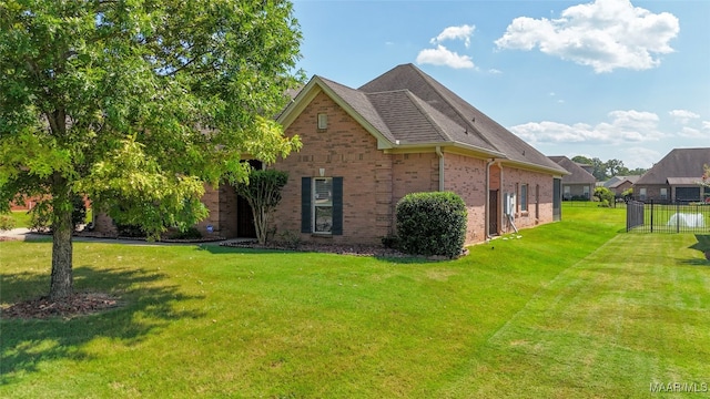 view of home's exterior with a lawn