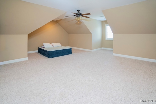 bonus room with lofted ceiling, carpet flooring, and ceiling fan