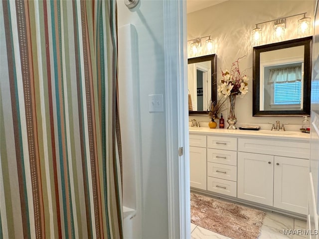 bathroom featuring double sink vanity and tile patterned flooring