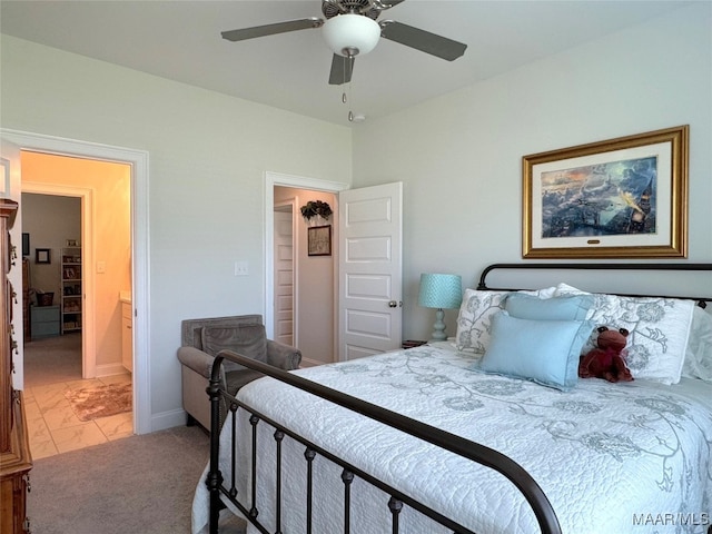 bedroom featuring ceiling fan and carpet