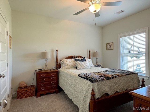 bedroom with ceiling fan and carpet