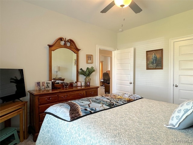 bedroom with ceiling fan and carpet floors