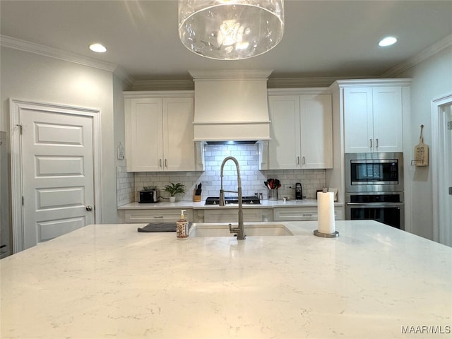 kitchen featuring appliances with stainless steel finishes, premium range hood, backsplash, and light stone counters