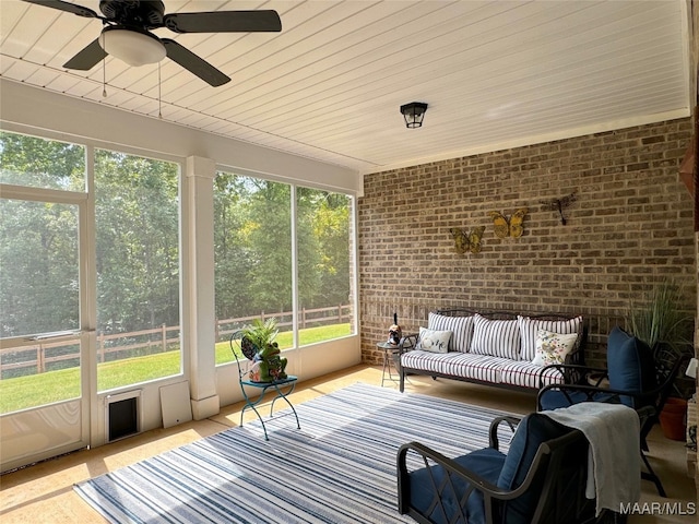 sunroom / solarium with ceiling fan and wooden ceiling