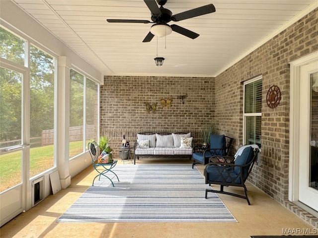 sunroom / solarium featuring ceiling fan and a healthy amount of sunlight