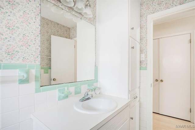 bathroom featuring hardwood / wood-style flooring and vanity