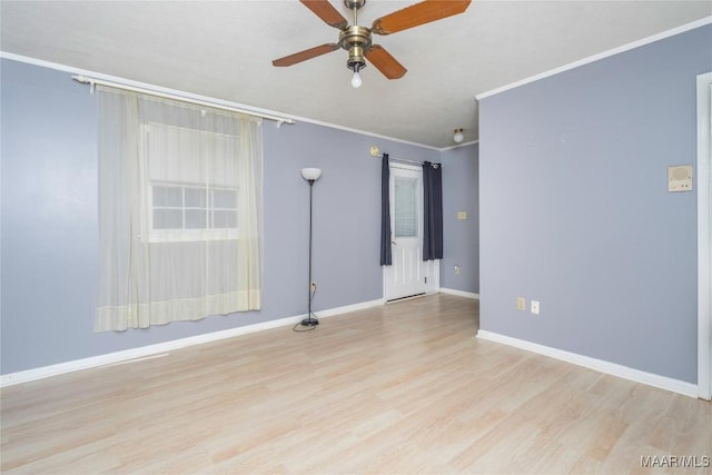 empty room with light hardwood / wood-style flooring, ceiling fan, and crown molding