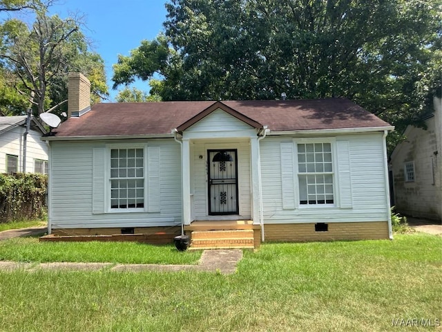 view of front of home with a front yard