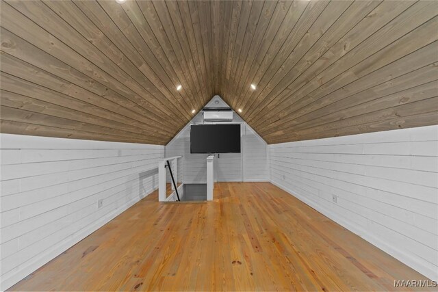 bonus room with vaulted ceiling, light hardwood / wood-style floors, and wooden ceiling