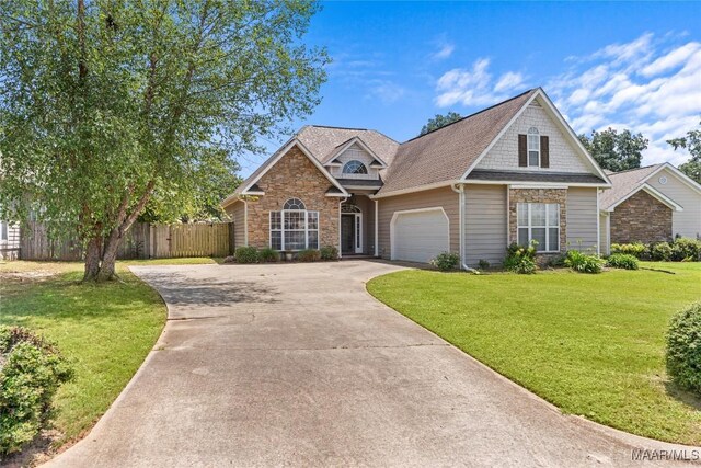 front of property with a garage and a front yard