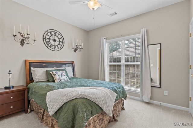 bedroom with light colored carpet and ceiling fan