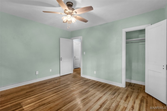 unfurnished bedroom featuring ceiling fan and light hardwood / wood-style floors