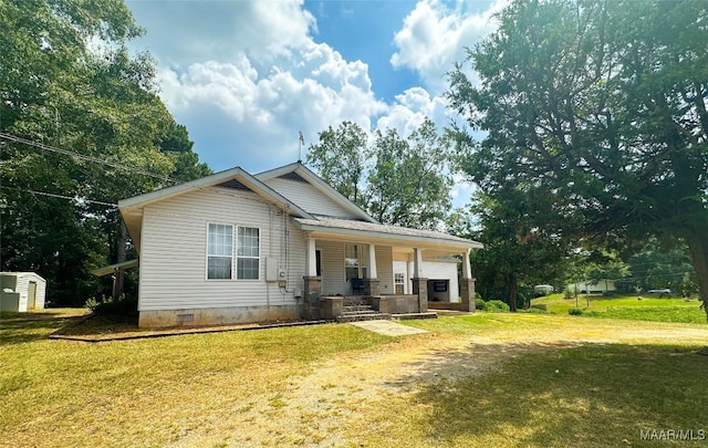 view of front of home with a porch and a front yard