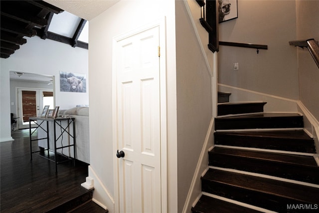 stairs with hardwood / wood-style floors