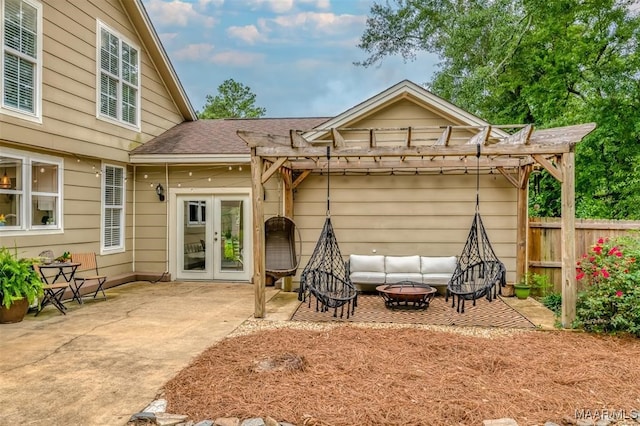 view of front facade featuring a pergola, a patio, and french doors