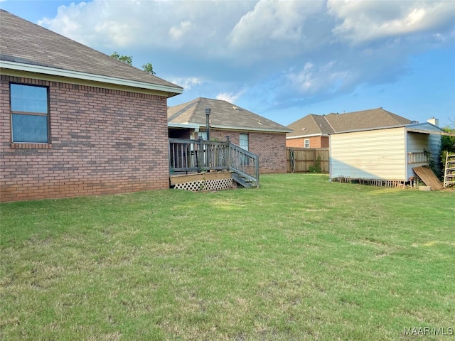 view of yard featuring a wooden deck