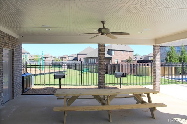 view of patio / terrace featuring ceiling fan, a residential view, and fence