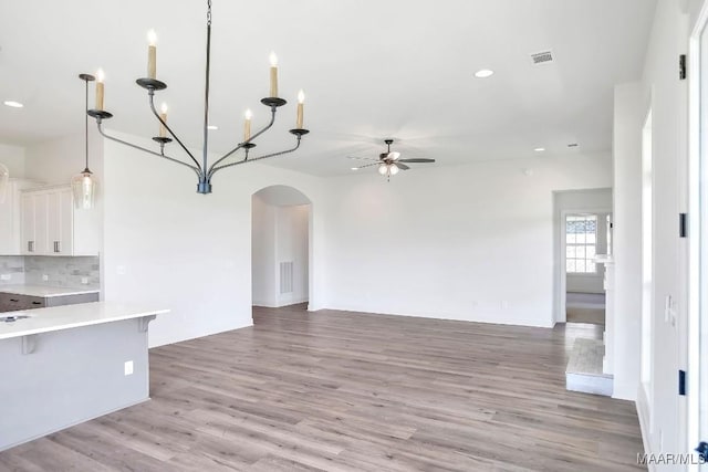 1415 Barret Park Way, Montgomery, AL 36117 - kitchen featuring ceiling fan, open floor plan, light countertops, light wood-type flooring, and white cabinetry