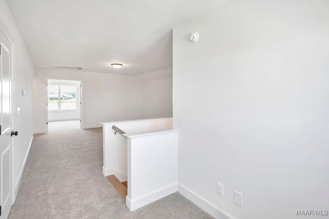1415 Barret Park Way, Montgomery, AL 36117 - hall with an upstairs landing, light carpet, and baseboards