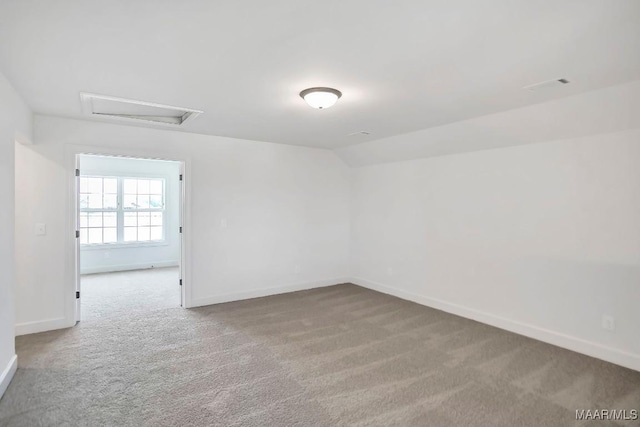 1415 Barret Park Way, Montgomery, AL 36117 - unfurnished room with attic access, carpet floors, and vaulted ceiling