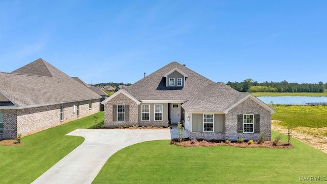1415 Barret Park Way, Montgomery, AL 36117 - view of front of house with brick siding, a water view, a front yard, and roof with shingles