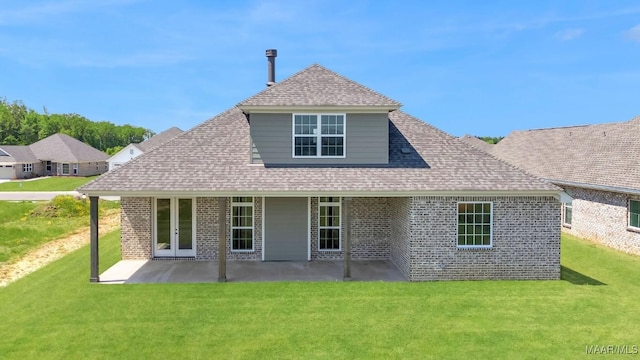 1415 Barret Park Way, Montgomery, AL 36117 - back of property featuring brick siding, a yard, a patio, and roof with shingles