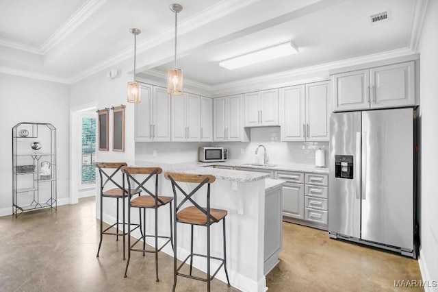 1415 Barret Park Way, Montgomery, AL 36117 - kitchen featuring stainless steel appliances, a kitchen bar, finished concrete floors, hanging light fixtures, and light stone countertops