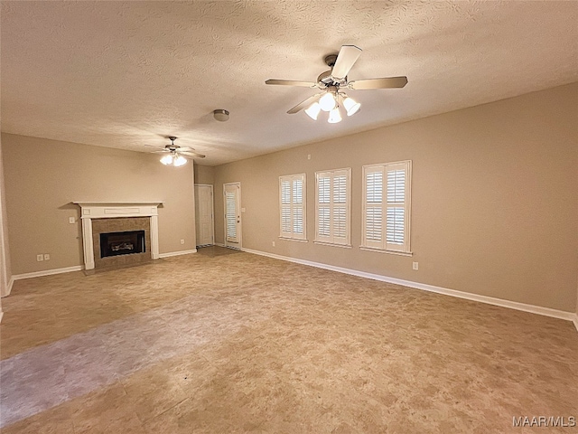 unfurnished living room featuring a textured ceiling and ceiling fan